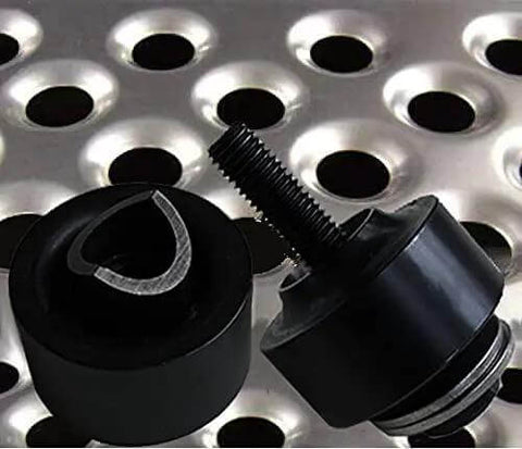 1 Inch Hole Punch And Flare Tool With Dimple Plate Dies In Black Steel for DIY metal fab, shown with pierced metal sheet backdrop