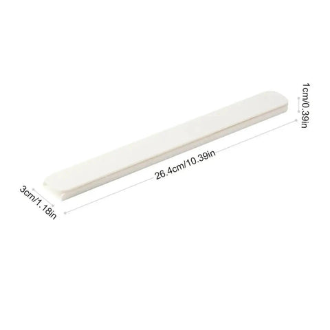 Dimensional view of white plastic bar measuring 26.4cm length, 3cm width, and 1cm height