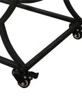 Detail of the four swivel casters on the Slick Two Tier Rolling Bar Cart With Black Metal Frame And Rustic Wood Accents.