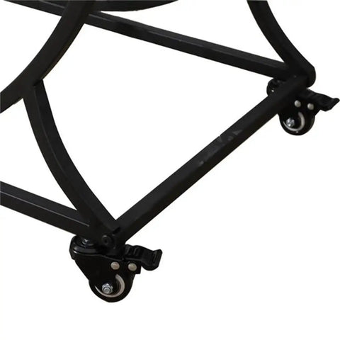 Detail of the four swivel casters on the Slick Two Tier Rolling Bar Cart With Black Metal Frame And Rustic Wood Accents.