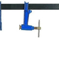Premium Steel Plunger Screw Clamp Featuring Beefy T Handle And No Nonsense Non Slip Braking Mechanism For Killer Holding Power On Demanding Construction Sites on a workbench.