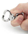 Close-up of nickel-plated die-cast trigger snap clip held in hand