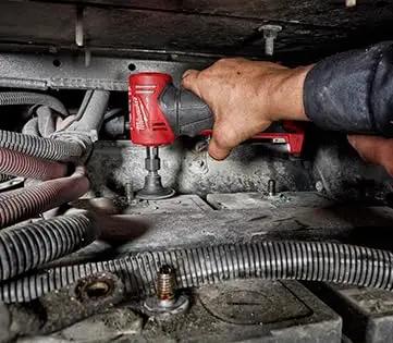 Top Shelf Brushless Right Angle Die Grinder 12V Cordless Powerhouse in tight space, ideal for detailed auto work.