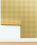 Top Shelf Buffalo Check Gold Metallic Wallpaper With Fibrous Texture For High End Indoor Spaces Paste The Wall Application Eco Friendly And Made In America Type I Wallcovering Class A Fire Rated rolled against the wall.