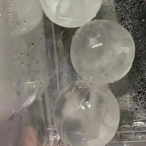 Countertop Ice Maker Machine Portable Sphere Creator Unit With Auto Self Cleaning And Responsive Touch Panel For Fast No Sweat Daily Batch Production At Home Bars And Weekend Sessions Party Ready Style with spherical ice cubes.