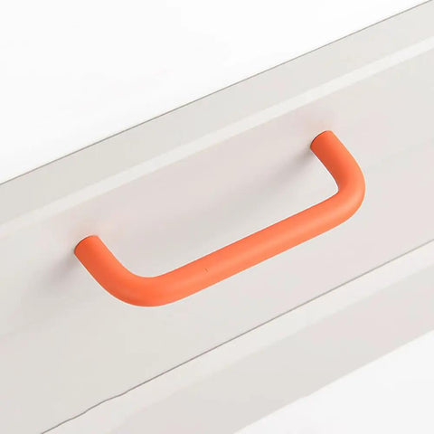 Orange handle on a white cabinet, resembling product focus: 4 Pack 3.8 Inch Double Hole Cabinet Pulls Curved Metal Drawer Handles