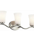 Three Light Vanity Light In Brushed Nickel With Satin Etched White Glass 23 Inch Wide Bath Lighting For Above The Mirror Classic Yet Modern Look That Really Pops For Traditional Or Contemporary Bathrooms, featuring three lights on a brushed nickel wavy arm design and satin etched white glass shades.
