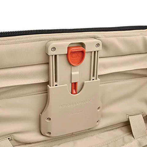 Briggs & Riley Baseline luggage latch on beige softside bag with orange release button (close-up)