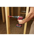 Rock Solid One Half Inch Cordless Compact Hammer Drill Driver Kit Featuring All Metal Gear Case And Rugged Chuck For Tight Quarters With Knockout Performance And Built Like A Tank Durability in use drilling into wood.