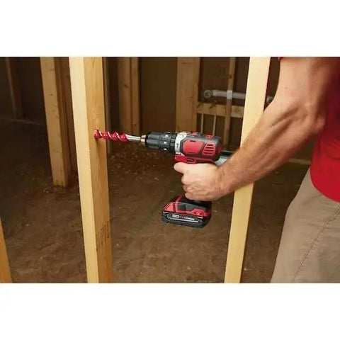 Rock Solid One Half Inch Cordless Compact Hammer Drill Driver Kit Featuring All Metal Gear Case And Rugged Chuck For Tight Quarters With Knockout Performance And Built Like A Tank Durability in use drilling into wood.