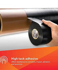 Applying All-Weather Vinyl Corrosion Protection Tape 50, 2 in x 100 ft, Black PVC, 10 mil, on a pipe for insulation and protection