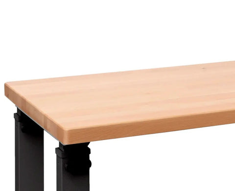 Side view of UltraHD Heavy Duty Workbench Table With Solid Wood Top 1000 Lbs Capacity Ideal Garage Workshop And Warehouse Desk Graphite Finish 72 W 25 D 28.5 To 42 H Adjustable Height showing the edge of the wood top and part of the black metal frame.
