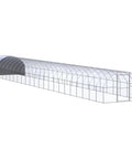 Long greenhouse structure with arched roof and transparent walls, showcasing a potential design for the spacious outdoor chicken coop.