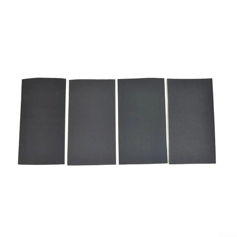 Four black sheets from the 15-Piece Wet And Dry Sandpaper Set With Silicon Carbide Sheets For Metal Wood Glass And Plastic Polishing Grits 200-3000