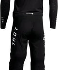 Back view of black THOT performance outfit with colorful accents, designed for active use and comfort.
