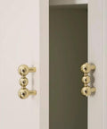Heavy Duty Solid Brass Cabinet Knob With A Slick Single Hole Design And Top Shelf Modern Hardware Upgrade For Kitchens Cupboards Wardrobes And Bedroom Furniture on white cabinetry.