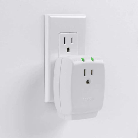 Compact Single Outlet Surge Protector Wall Tap With Grounded Outlet And Protected Light Indicators, installed on wall.