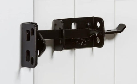 Heavy Duty Gate Latch With WeatherGuard Protection For Outdoor Fences And Wooden Gates, Black Finish shown installed on white fence
