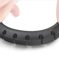 Close-up of a black silicone cable holder clip from the Three Pack Cable Holder Clips For Cord Management Self Adhesive Silicone Clips.