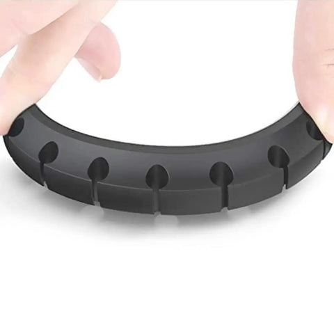 Close-up of a black silicone cable holder clip from the Three Pack Cable Holder Clips For Cord Management Self Adhesive Silicone Clips.