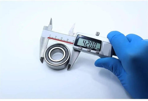 Rock Solid CSK6004 One Way Bearing Clutch 20x42x14mm measured with caliper for precise sizing in power tools.