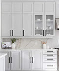 30 Pack 5 Inch Kitchen Square Cabinet Handles Matte Black Pulls installed on modern white cabinets for easy open and close.