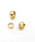 Angled view of three brass compression sleeves for 3/8-inch tubing on white background