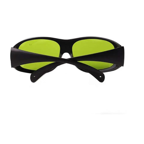 Top Shelf Laser Safety Glasses Lock Out Intense 755 808 And 1064 Nm NdYag Beams Via Thick Clear Lenses with black frame and green lenses.