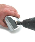 Spectre Performance 8711 vacuum sensor adapter kit; chrome metal adapter being installed with a drill.