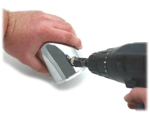 Spectre Performance 8711 vacuum sensor adapter kit; chrome metal adapter being installed with a drill.