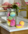 Real Deal Wide Mouth Glass Mason Jars With Lids And Bands For Canning And Pickling Quart 32 Oz Pack Of 2 featuring colorful bath bombs.