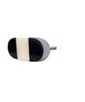 Set Of Six Oval Marble Cabinet Knobs Black And White Pattern For Kitchen Dresser Upgrade Zero Fuss Install Solid Build Quick Swap Hardware For A Top Notch Home Glow Up. Single oval marble knob with black and white design showing side view.