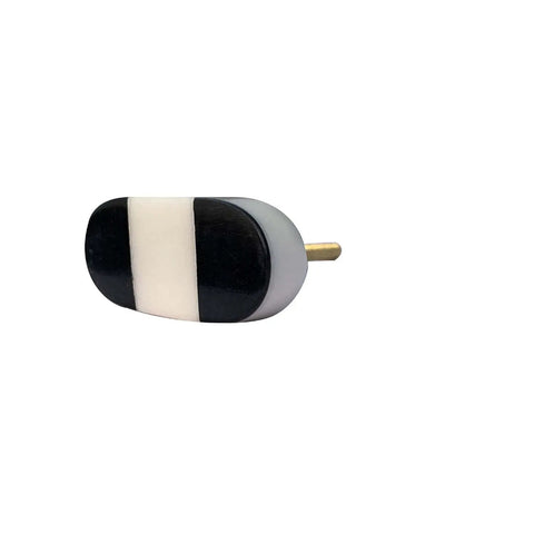 Set Of Six Oval Marble Cabinet Knobs Black And White Pattern For Kitchen Dresser Upgrade Zero Fuss Install Solid Build Quick Swap Hardware For A Top Notch Home Glow Up. Single oval marble knob with black and white design showing side view.