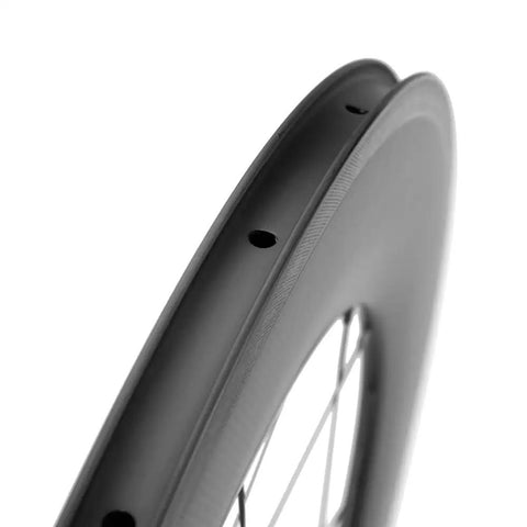 Close-up of Carbon Road Wheelset 700c Matte Finish Clincher With 88mm Rim Brake, showing the 88mm deep rim and basalt surface.