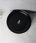 USZWBY Vessel Sinks Nordic Matte Black Round Art Sink above counter view, ceramic wash basin on marble surface.