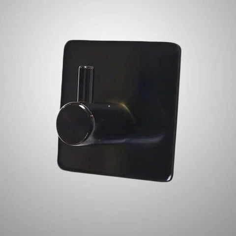 Rock Solid Black Stainless Steel Adhesive Wall Hook For Coats Towels And Umbrellas With No Hassle Peel Stick Mount, close-up view.