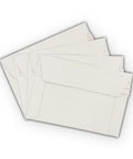 Stack of Rigid 6.5 By 4.5 Inch Photo Mailers White Cardboard Stay Flats With Peel And Stick Adhesive 250 GSM Self Sealing