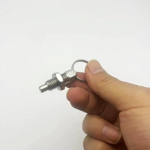 Top Tier Stainless Steel 304 Plunger Springs And Pull Locking Pins Built Tough For Heavy Duty Jobs No Rust Hassle Straight Shot Install Ready To Rock 4 Pack M10 Metric - Stainless steel pull pin held in hand.