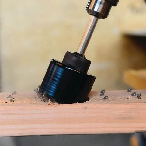 Spyder 1/2-in hex hole saw pilot bit with black housing drilling into wood