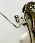 3 Pack Thumb Stud Replacement For Buck 110 Knife With Hex Wrench In Black Silver Brass Colors next to knife handle