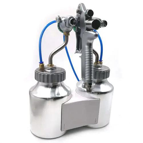 Heavy Duty Double Nozzle Pneumatic Spray Gun With Pressure Feed features dual stainless paint cups and 1.3mm nozzles for precise application.