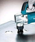 Person using Powerful 710W Nibbler With 3.2 mm Capacity, Soft Grip Ergonomic Handle, on metal sheet under chip clearance system