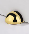 Heavy Duty Hidden Door Holder Catch Floor Mounted Nail Free Stainless Steel Stopper on floor with a sleek black and gold design.