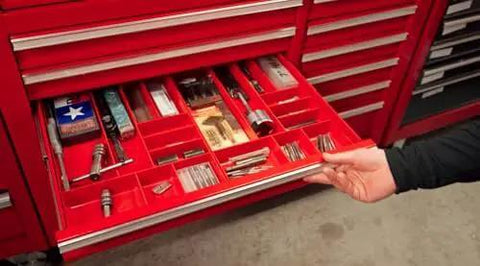 Red tool organizer tray with 10 compartments in drawer, storing tools and parts, similar to Green 10-Compartment Tool Organizer Tray for Garage.