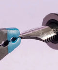 Nib Removal Tool Kit With Plier And Rubber Sheet For Fountain Pen Nib Slit Widening And Protection, close-up of plier in use.