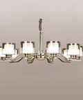 Slick Nickel Four Bulb Led Pendant Chandelier casts pure 5500k white light with modern design and four frosted glass bulbs.
