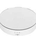 This Awesome Electric Rotating Turntable Display Stand Boasts Heavy Duty 10KG Load Bearing Power For Glittering Jewelry Watches And Digital Gadgets With Smooth Two Way Spin Action And Sleek Mirror Finish Built Tough! - Top view of sleek white rotating display stand.