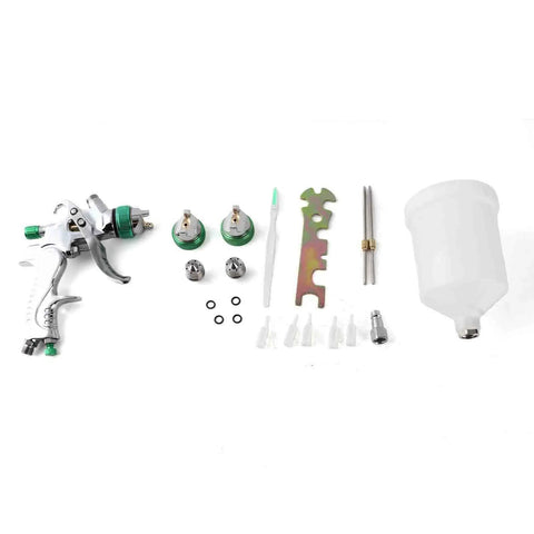 Professional Grade Hvlp Paint Sprayer Kit With Six Hundred Mil Gravity Tank And Three Nozzle Heads with parts and accessories arranged.