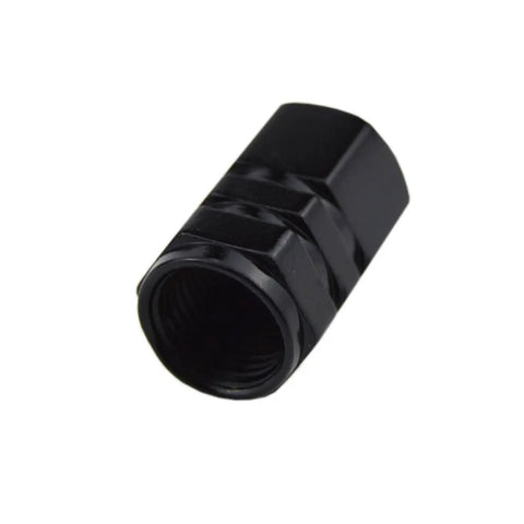 Close-up of black aluminum alloy cap from Dodge Valve Stem Caps Set Of 4 With Aluminum Alloy Cap Trim And Resin Emblem 360 Degree Rotating Tire Valve Covers Durable Auto Accessory For Charger Challenger SRT Durango Dart Journey Magnum Nitro Caliber Avenger.
