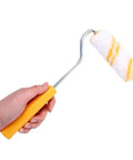 Slick 10 Piece Mini Paint Roller Covers Heavy Duty Acrylic Dripless Wall Wood Fabric Decorating Kit being held, showcasing the roller's absorbent texture.